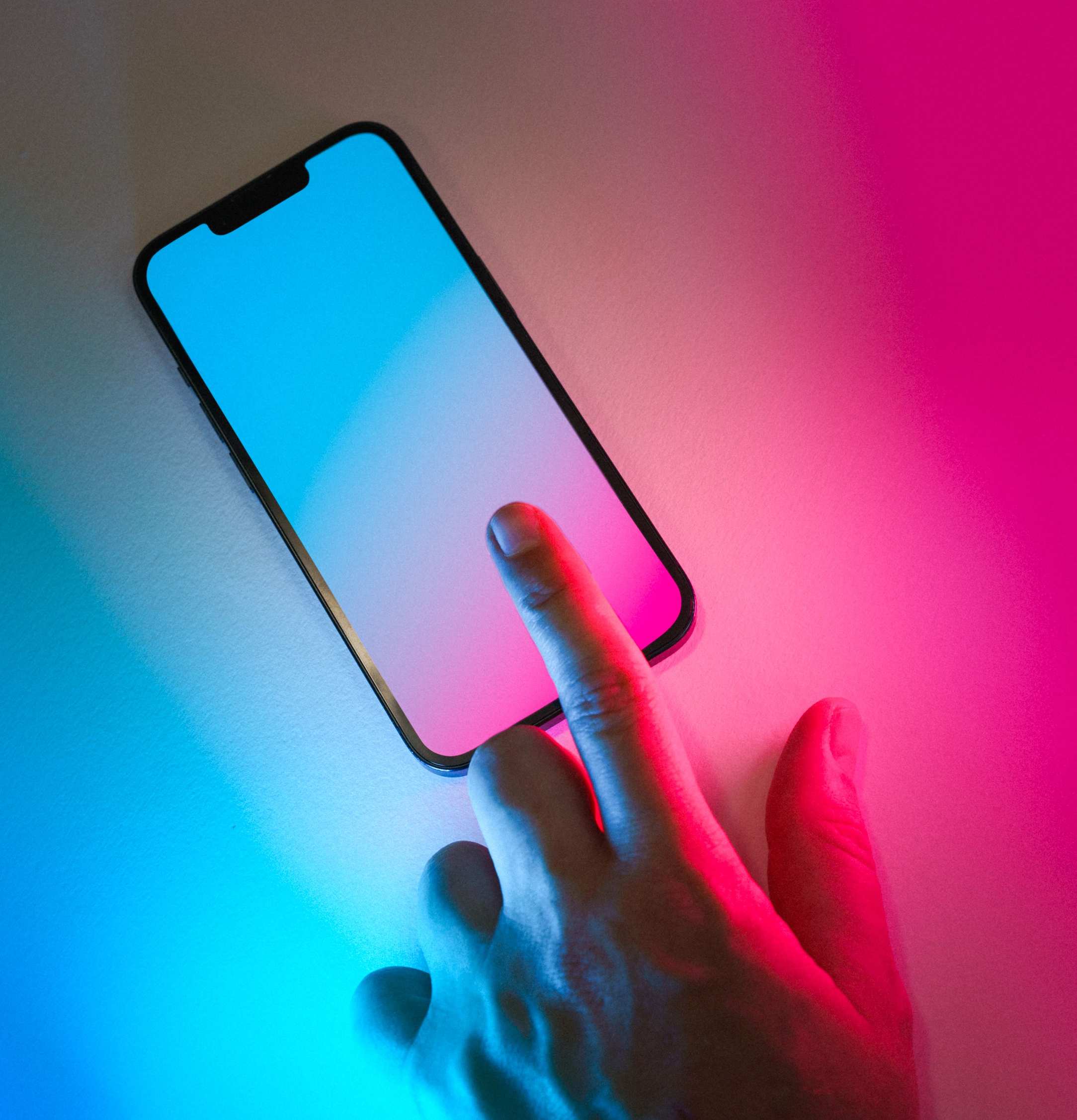 Close view of a smartphone showing a mobile app screen — hand holding smartphone with application interface visible
